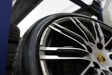 Leased Scuffed, scratched Porsche car diamond cut alloy wheel